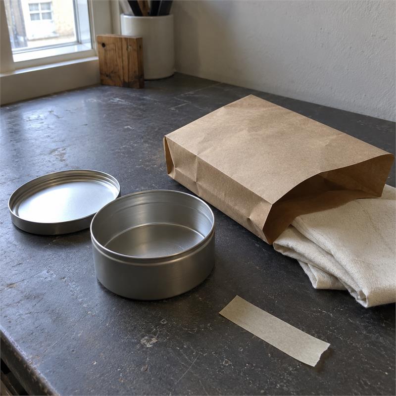 Simple packaging and product materials on a small business workbench